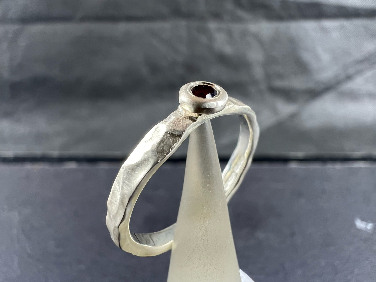 Kelly-Hopkins, Deborah – Silver ring with garnet