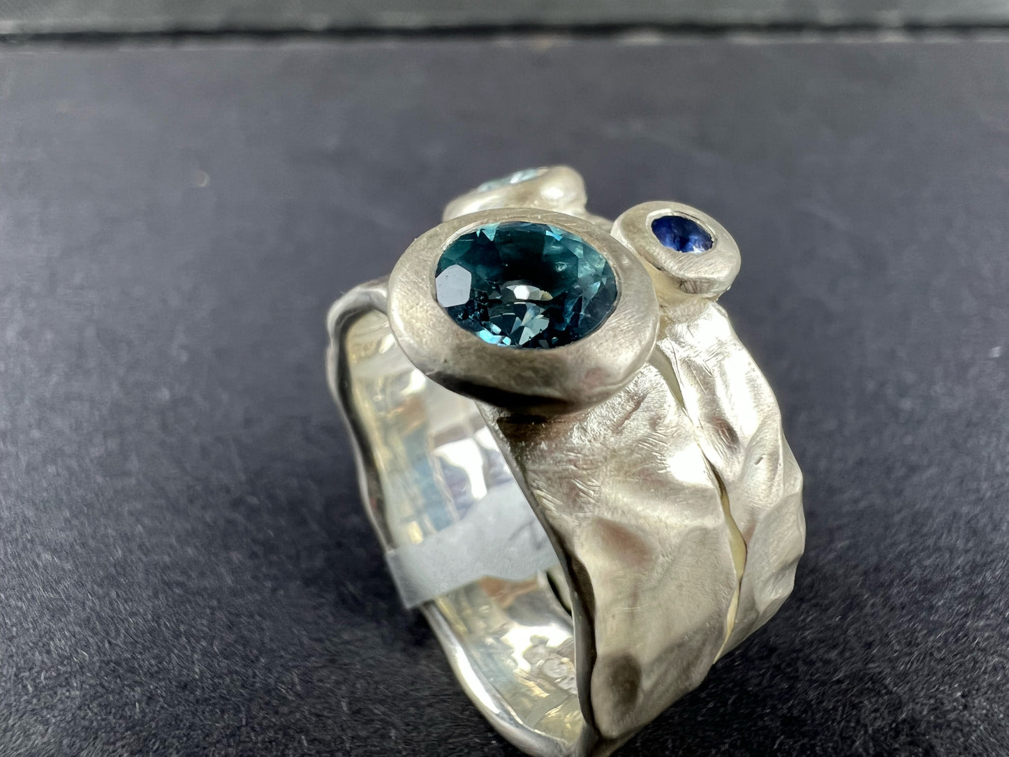 Kelly-Hopkins, Deborah – Silver ring with blue topaz, aquamarine, sapphire and diamond.